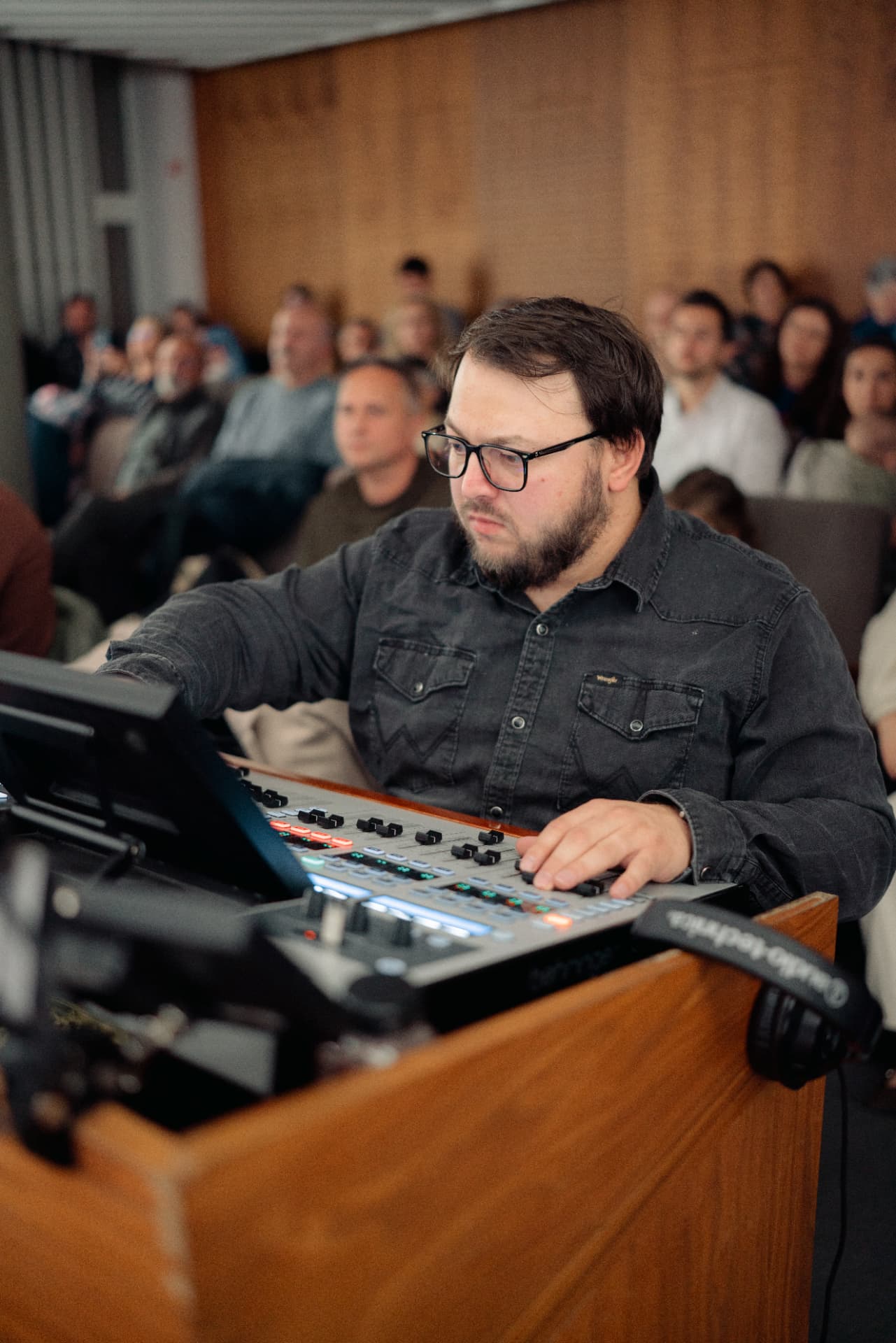 Emanuel Daniciuc at the mixing desk during a live show
